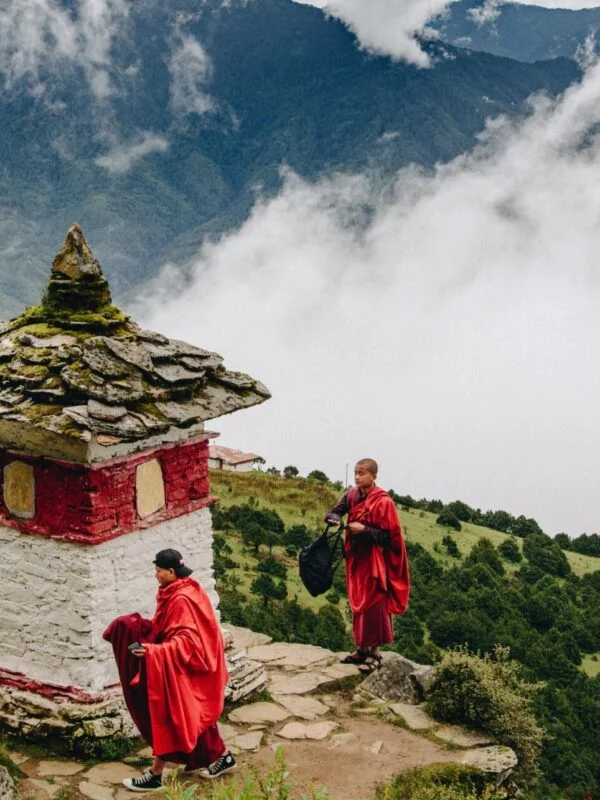 Monks on a mountain in the clouds, spotted on a school trip