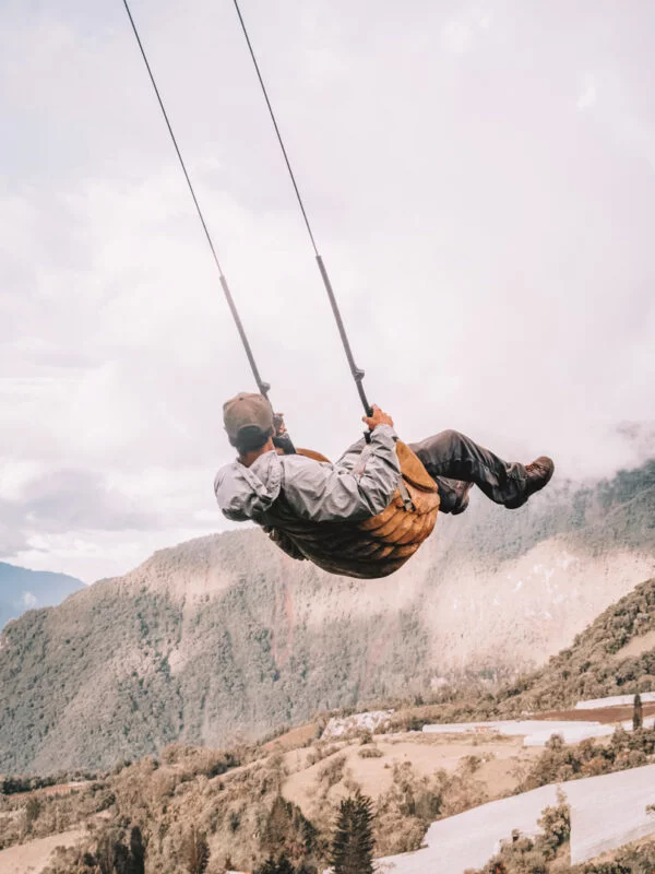 A student on a swing in Ecuador on a school expedition