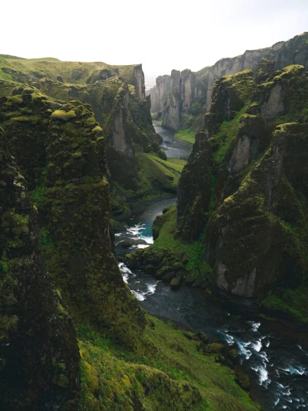 Exploring a river running between two tectonic plates in Iceland on a geography field trip