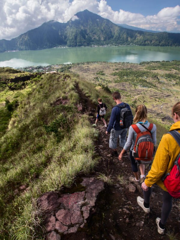 A school expedition group hiking on the Caldera of volcano Batur in Bali